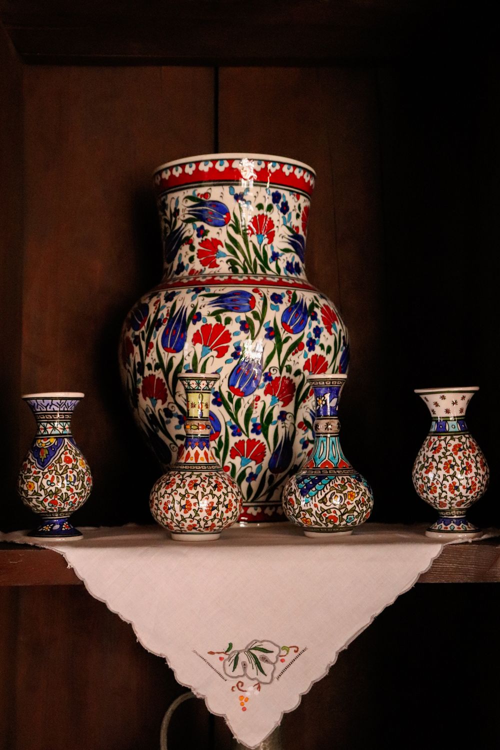 A wood-fired stoneware vessel with mottled ash glazing.