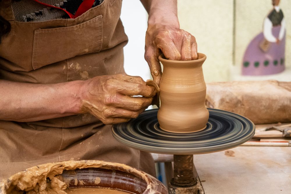 A balanced stack of five hollow stoneware stones.