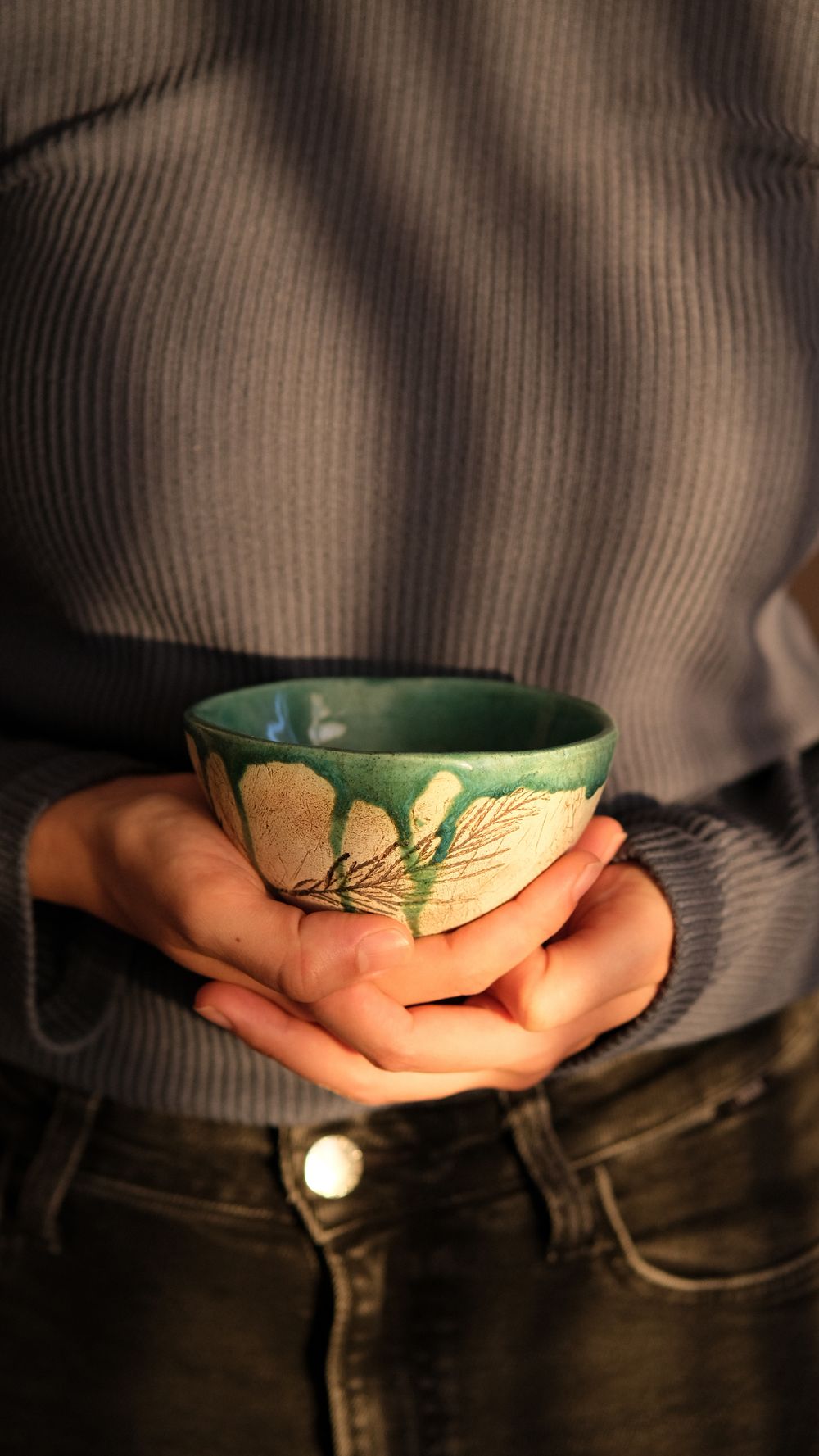 A warm sienna-glazed earthenware serving bowl.
